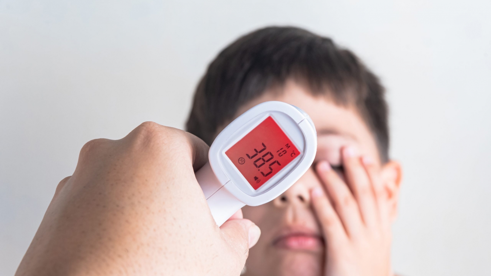Measuring the fever of a cute boy